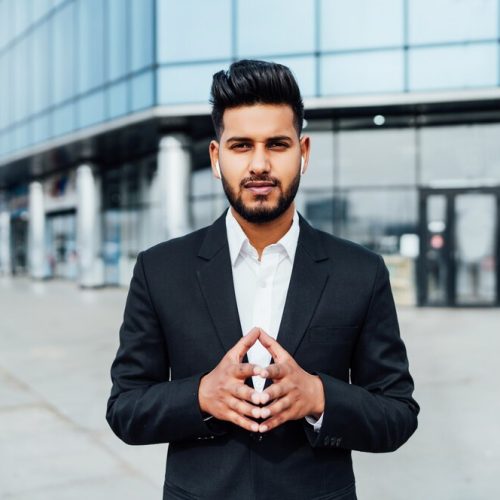 portrait-serious-smiling-modern-indian-man-near-office-building_496169-2890 portrait-serious-smiling-modern-indian-man-near-office-building_496169-2890